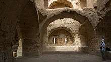 A room with well-built masonry walls and arches