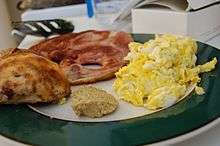 Ham and eggs served with a ham steak and scrambled eggs