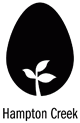 A black egg on a white background. A sprout is growing from the bottom of the egg.