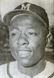 A black-and-white photo of Hank Aaron