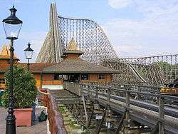 An overview of the station and lift hill of Colossos at Heide Park