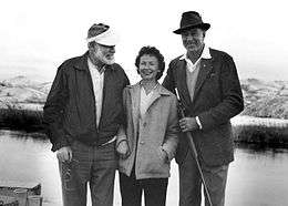 Photo of Ernest Hemingway, Bobbi Powell, and Gary Cooper during a hunting trip