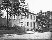 1879 photograph of Henry House with a carriage out front