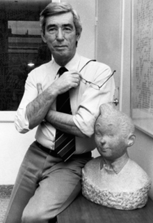 Hergé, with a bust of Tintin.