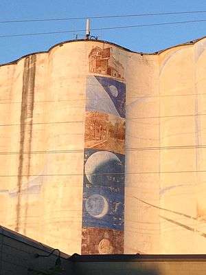 The Harvest States grain elevator with a mural on its west side.