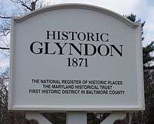 Signs at the entrance and exit of Glyndon note the 19th century village's historic significance.