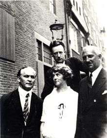Harry Houdini (left), Malcolm Bird (back), Mina Crandon (middle), O. D. Munn (right).