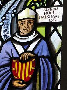 Hugh Balsham shown in a window at Thriplow church