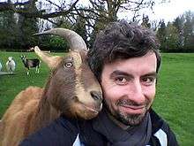 Dr Christian Nawroth is a scientist that studies animal cognition and is pictured with one of his goats.