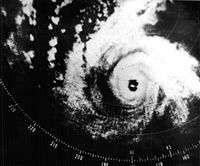 A radar image depicting a mature and well-formed storm, with a pronounced eye at the center and curved bands.