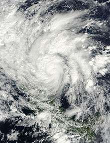 Satellite image of a tropical cyclone just onshore the Nicaragua coastline. Most of Central America is obscured by the storm except Panama which is located southeast of the cyclone. The storm displays the classic counterclockwise rotation of low pressure systems in the northern hemisphere.