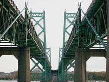 Parallel bridges cross a river