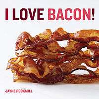 Book cover, white with title at top in bold upper case letters in shades of brown and red. Beneath it a color photograph of a pile of grilled bacon