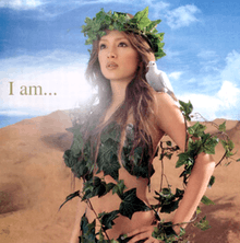 A body shot of a woman (Ayumi Hamasaki) wearing vines and leaves around her body, letting down her brown hair. As she looks towards a distance, a dove sits on her shoudler whilst standing in front of a desert-like surrounding. The title of the album is superimposed on the image.