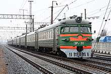 Green-and-orange electrified train