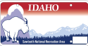 Idaho's SNRA license plate featuring a mountain goat, the Sawtooth Mountains, and a forest