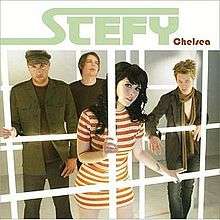 The four members of Stefy stand behind computerized jail bars, with the lead singer, Stefy Rae, standing in the center front.