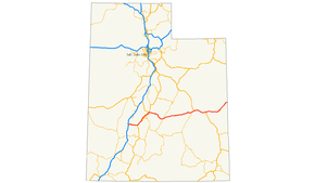 Map of Utah with several Interstate Highways converging at Salt Lake City in blue. The red line instead runs east-west across the central part of the state.