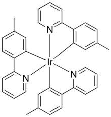 Skeletal formula of a chemical compound with iridium atom in its center, bonded to 6 benzol rings. The rings are pairwise connected to each other.