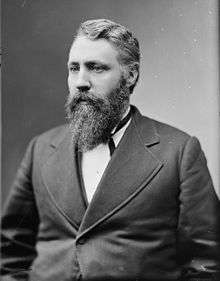 Vintage Black and White photo of a bearded man with a suit