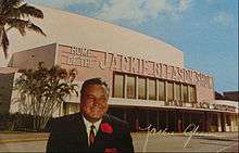 Autographed color photo of Gleason in front of Miami Beach Auditorium