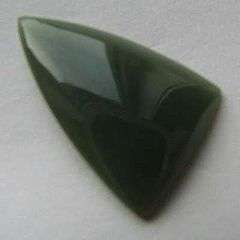 A freeform triangular cabochon of olive-green Wyoming nephrite jade.