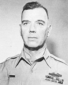 Head-and-shoulders photo of General James Van Fleet, 60-year-old white man shown wearing khaki uniform blouse, four-star insignia and neckerchief.