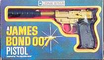 A toy pistol, in gold, with a black silencer: the item is still in a box