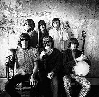 Jefferson Airplane in front of an interior wall at The Matrix