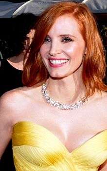 A photograph of Chastain smiling at the 2016 Cannes Film Festival
