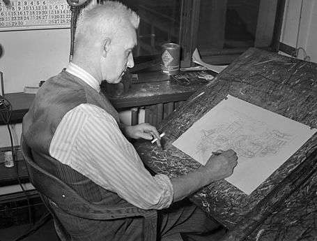 Black-and-white photo of a man drawing