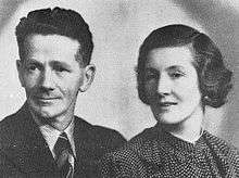 A photograph of a middle-aged man and woman
