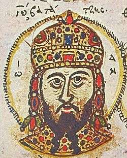 Head portrait of a middle-aged man with a dark, forked beard, wearing a golden, jewel-encrusted domed crown