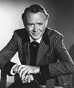 Black and white photo of John Mills in 1965.