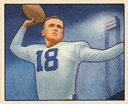 Football card illustration of Rauch wearing white jersey no. 18 and football pads (but no helmet), apparently preparing to pass the football.
