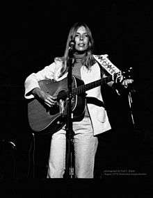 Joni Mitchell plays guitar in 1974