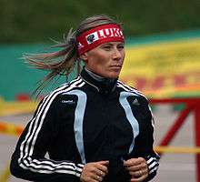 Yuliya Chepalova running in a track suit.