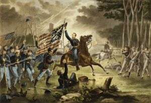 A high-ranking military officer charging on horseback. He is lifting his hat in the air and looking backwards at his fellow Union soldiers in blue uniforms behind him, one of whom carries a United States flag. He is apparently unaware of the enemy soldiers in front of him who are aiming their muskets at him. A jagged lightning bolt is streaking across the dark and cloudy sky.