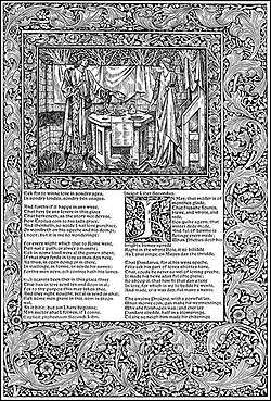 A printed page. A picture and some text and set asymmetrically in a wide band decorated with a leaf motif. The text shows the last few verses of Book I and the start of Book II of Troilus and Criseyde. The first letter of Book II is ornately decorated. Above the text, the picture is set in its own decorated border. It shows the tall slender figures of a man and a woman in long medieval clothing. Between them is a hexagonal table set with food and drink.