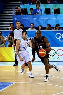 Kobe Bryant drives past a defender at the Olympics Game