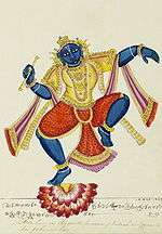 Hindu god Krishna with flute in hand dancing on a lotus flower