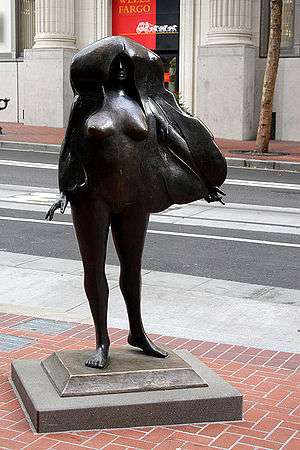 A nude bronze statue of a woman