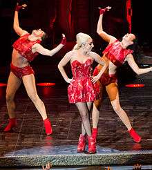 Gaga in a false meat dress with her dancers
