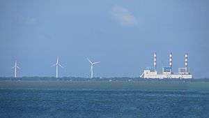 Three wind turbines of the Mampuri Wind Farm, located near the Lakvijaya Power Station.