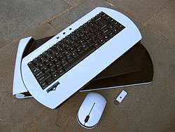 White wireless keyboard, with thumb drive and wireless mouse