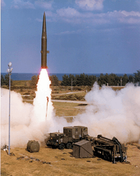 missile launching, missile in foreground prepared for launch