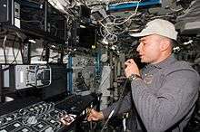 Lee Archambault at the Canada Arm 2 controls on ISS
