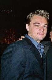 Leonardo DiCaprio is looking directly at the camera.