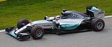 A picture of Lewis Hamilton driving a Mercedes F1 W06 Hybrid formula one car during the 2015 Canadian Grand Prix.