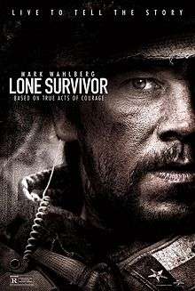 Half of one man's face is shown on the right side of the poster. The man has a beard and is wearing a military uniform. Across the top of the poster is the tagline, "Live to tell the story", in uppercase white. On the top left side of the poster is the name, "Mark Wahlberg", in uppercase white, laying above the film title Lone Survivor. Underneath the film title, in uppercase white, is a second tagline, "Based on true acts of courage".